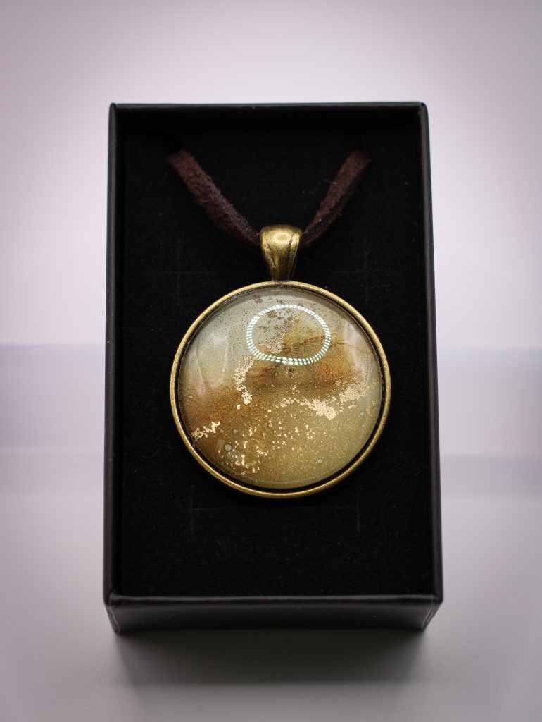 Aranypor- antikolt bronz medálban